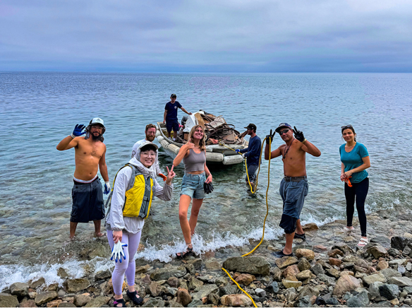 Kayaks cleanup shipwreck debris